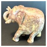 Two Decorative Stone Figurines: Egyptian Sphinx and Elephant