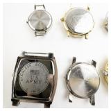 Group of 6  Silver Tone Base Metal Quartz Analog watches. Need Bands.. New Battery Installed!