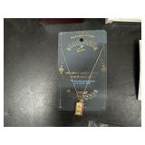 Necklaces in original packaging and Collector Pins