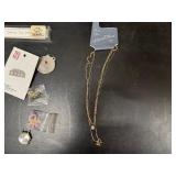 Necklaces in original packaging and Collector Pins