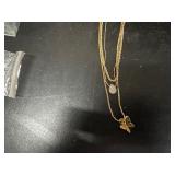 Necklaces in original packaging and Collector Pins