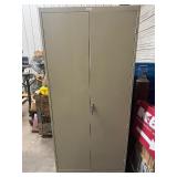 Two Door Metal Cabinet. 36" x 18" x 78". Five Shelves. In Very Good Condition.