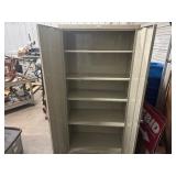 Two Door Metal Cabinet. 36" x 18" x 78". Five Shelves. In Very Good Condition.
