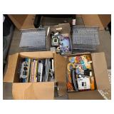 Three Boxes of Office Supplies, Adding Machines, Calculator, Pencil Sharpeners, Sheet Covers, Notebooks, Two Matching Metal Hanging File Organizers and more