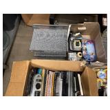 Three Boxes of Office Supplies, Adding Machines, Calculator, Pencil Sharpeners, Sheet Covers, Notebooks, Two Matching Metal Hanging File Organizers and more