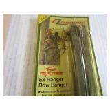 Climbing spikes, bow hanger in pack...