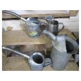 Vintage oil & water cans...