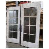 A SET OF TWO HEAVY DUTY STEEL AND GLASS METAL SAFETY DOORS