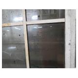 A SET OF TWO HEAVY DUTY STEEL AND GLASS METAL SAFETY DOORS