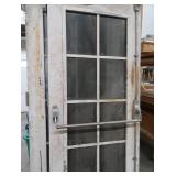 A SET OF TWO HEAVY DUTY STEEL AND GLASS METAL SAFETY DOORS