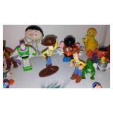 Assorted Action Figurines. Disney, Smurfs, Sesame Street, Toy Story.