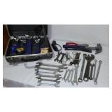Assorted hand tools. Wrenches, hammer, tape measure and more.