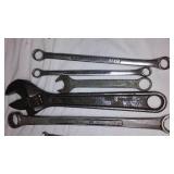 Assorted hand tools. Wrenches, hammer, tape measure and more.