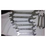 Assorted hand tools. Wrenches, hammer, tape measure and more.