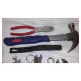 Assorted hand tools. Wrenches, hammer, tape measure and more.