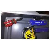 Assorted hand tools. Wrenches, hammer, tape measure and more.