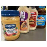 NE 1 - Collection of Assorted Condiments Including Aioli, Mayo, and Dressing