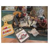 Carved wood and porcelain figurines...