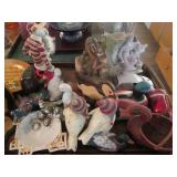 Carved wood and porcelain figurines...