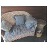 Wicker love seat and side table...