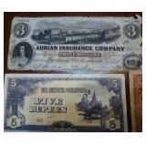 Variety of paper money and insurance certificate