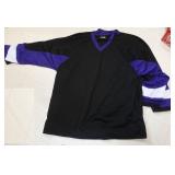 2 size XL black and purple hockey jerseys