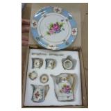 Two porcelain mini tea sets