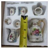 Two porcelain mini tea sets