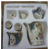 Two porcelain mini tea sets