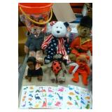 Sand pail full of beanie babies and dinosaur temporary tatoos