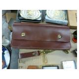 5 belt buckles, truckers wallet with chain, knife sheath, lighter, grain belt opener