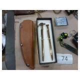 5 belt buckles, truckers wallet with chain, knife sheath, lighter, grain belt opener