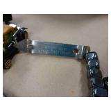 5 belt buckles, truckers wallet with chain, knife sheath, lighter, grain belt opener