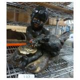 Black americana pottery figure with chicken