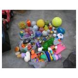 Large box full of balls, toys, stuffed animals