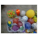 Large box full of balls, toys, stuffed animals