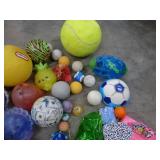 Large box full of balls, toys, stuffed animals