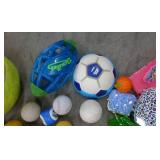 Large box full of balls, toys, stuffed animals