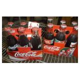 Coca-Cola Bottles and Plastic Carrying Cases - two six packs are full - all are 8 oz size