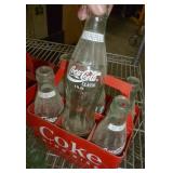 Coca-Cola Bottles and Plastic Carrying Cases - two six packs are full - all are 8 oz size