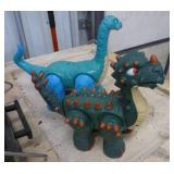 Two dinosaurs - dark green is battery operated