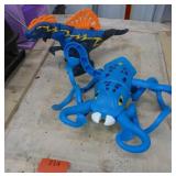 Two battery operated toys, walking/talking Trex dinosaur and squid