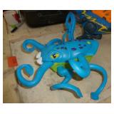 Two battery operated toys, walking/talking Trex dinosaur and squid