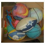 Lot of balls, frisbees, squirt guns, sand box tools