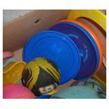 Lot of balls, frisbees, squirt guns, sand box tools