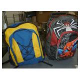 Two backpacks with sleeping bags inside