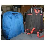 Two backpacks with sleeping bags inside