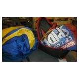 Two backpacks with sleeping bags inside