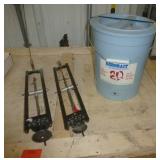 Two ice fishing tip ups and Aerobait bucket