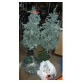 Two 4-foot christmas trees and 2 bags full of lights, the one bag must have 3 or 4 sets of lights